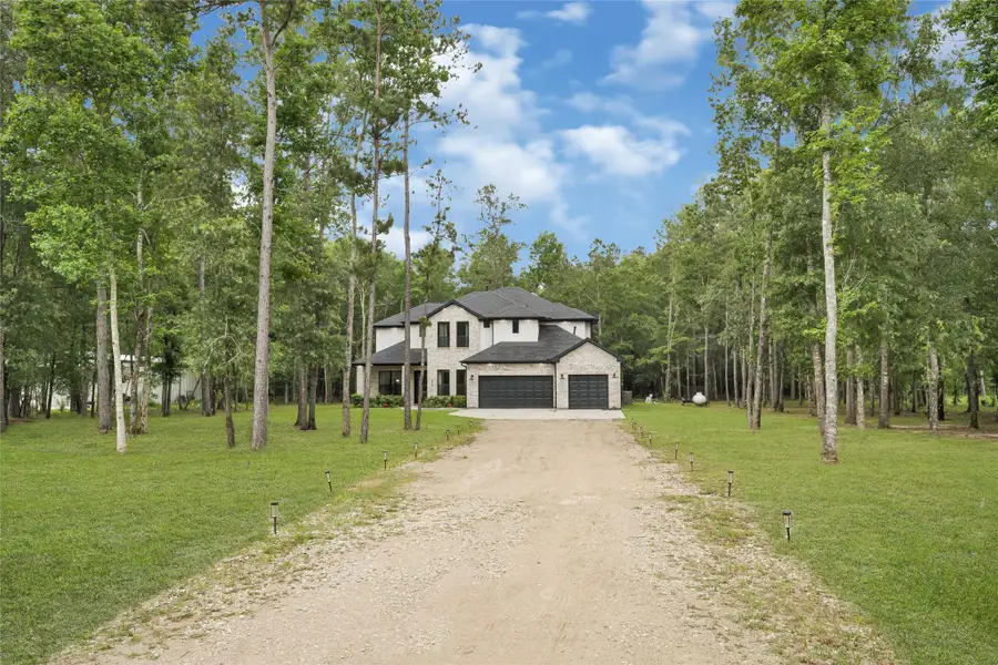 Front exterior of a new home in , Dayton, TX, highlighting curb appeal (Image 22).