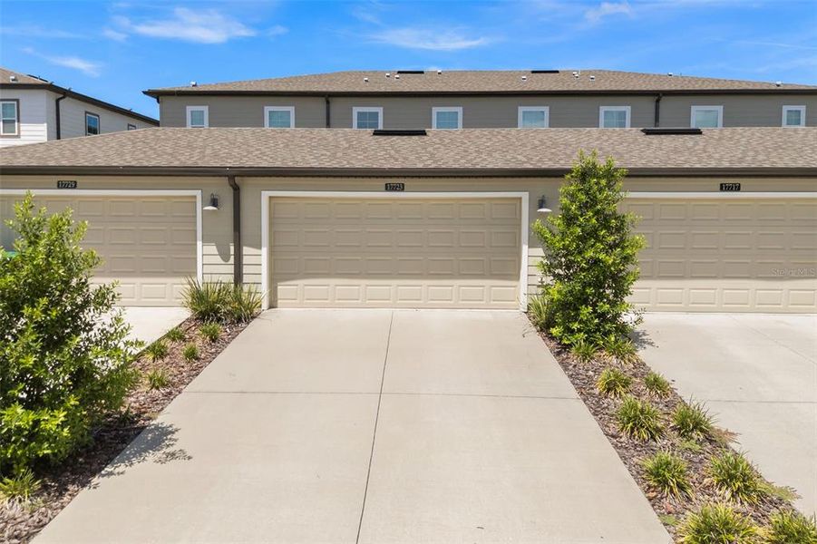 Front exterior of a new home in , Winter Garden, FL, highlighting curb appeal (Image 2). Front exterior of a new home in , Winter Garden, FL, highlighting curb appeal (Image 2).