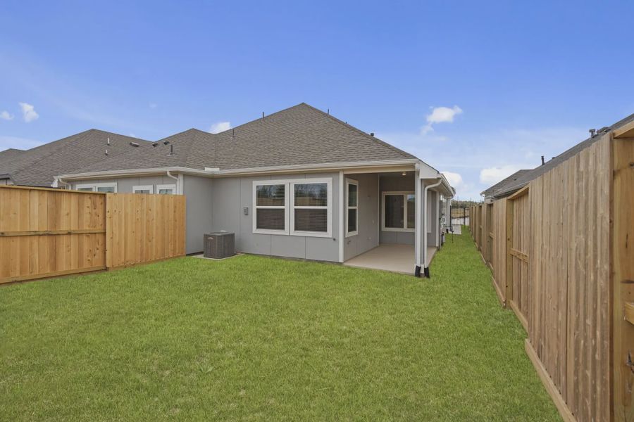 Representative exterior details of a home built from the Carriagehouse by Chesmar Homes in Meridiana Townhomes, Iowa Colony (Image 4).