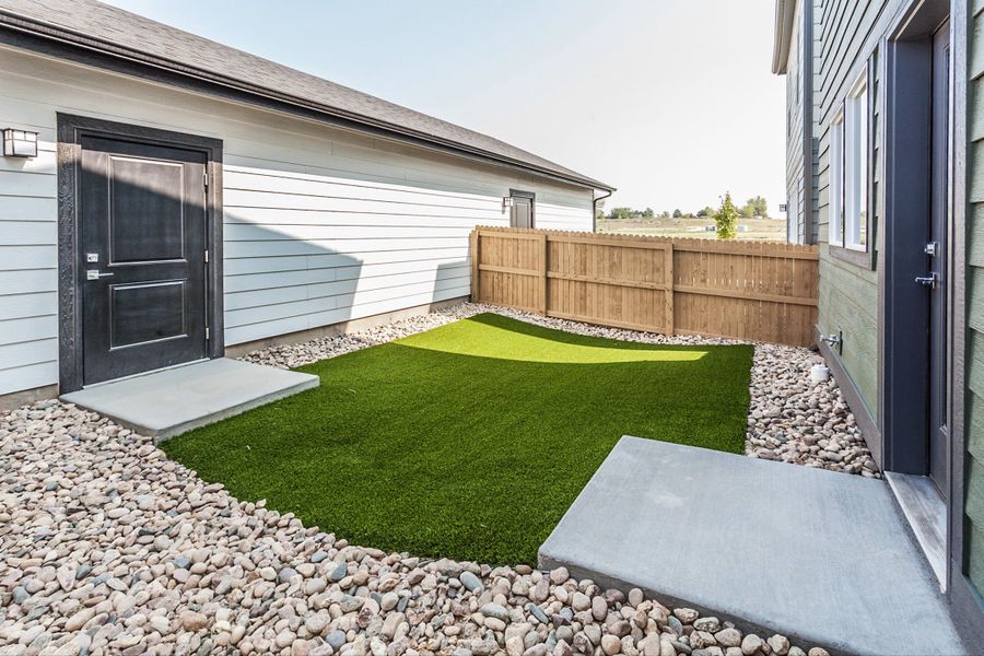 Exterior details and patio area of a home in Prairie Song, Windsor (Image 24). Exterior details and patio area of a home in Prairie Song, Windsor (Image 24).