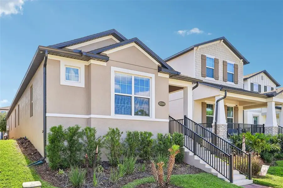 Front exterior of a new home in , Winter Garden, FL, highlighting curb appeal (Image 2). Front exterior of a new home in , Winter Garden, FL, highlighting curb appeal (Image 2).