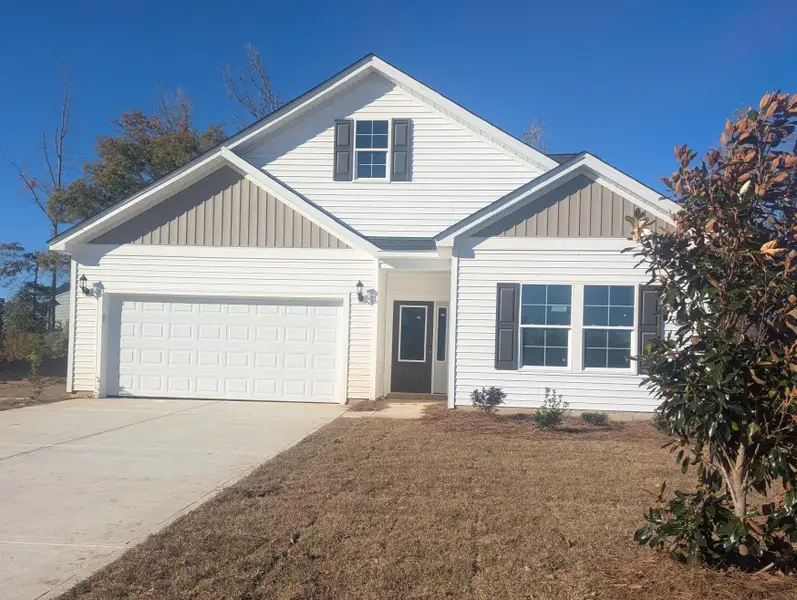 Front exterior of a new home in Allston Park, Calabash, NC, highlighting curb appeal (Image 1).