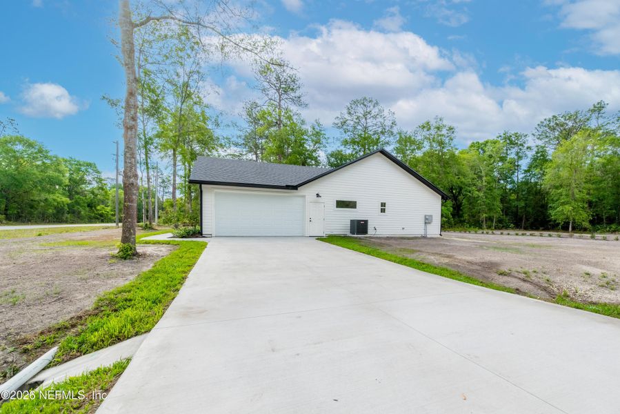 Front exterior of a new home in , Starke, FL, highlighting curb appeal (Image 26).
