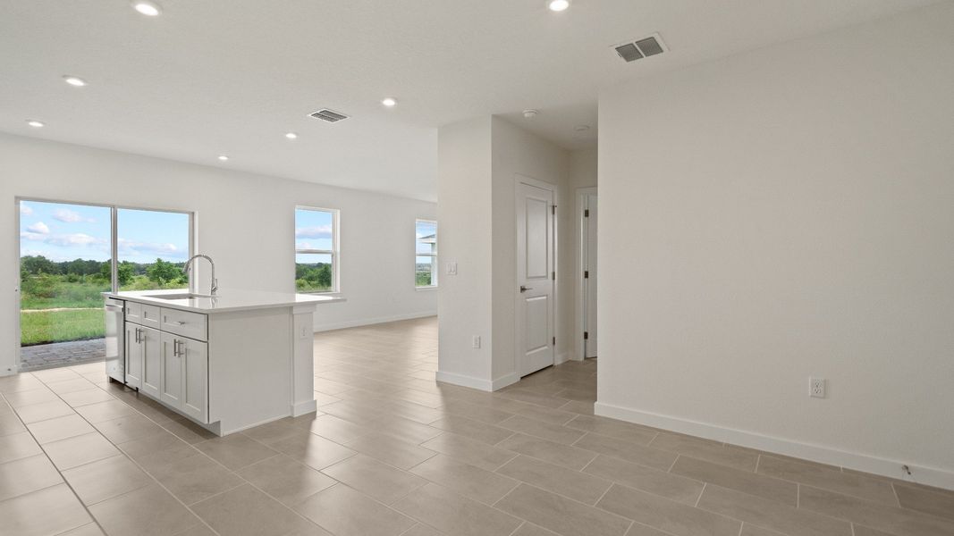 Spacious kitchen opens to bright living area—perfect for entertaining, with modern finishes and plenty of natural light