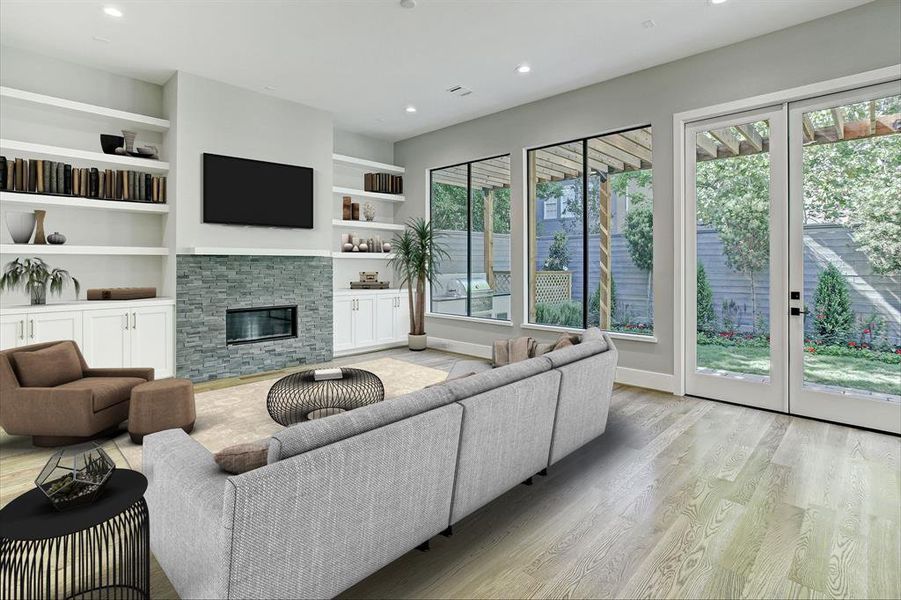 Wonderful family room overlooking the outdoor kitchen and pergola.