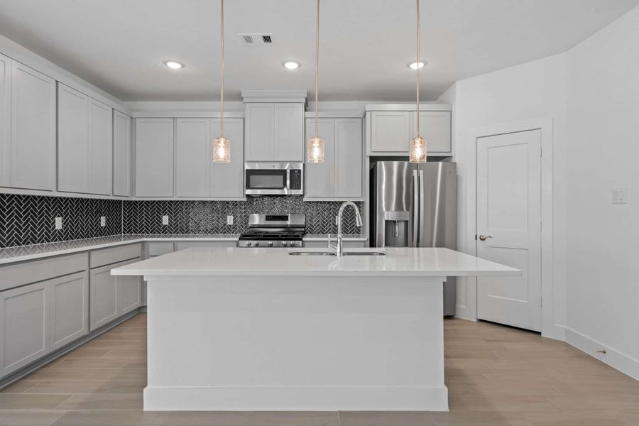 Furnished interior view inside a new home in Meridiana, Iowa Colony (Image 5).