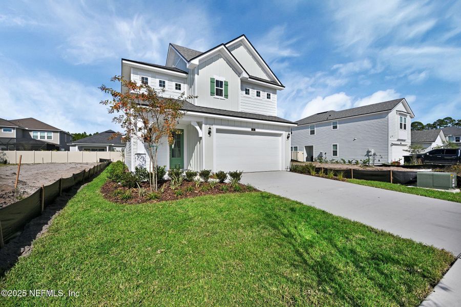 Front exterior of a new home in Seabrook Village at Nocatee, Ponte Vedra, FL, highlighting curb appeal (Image 22).