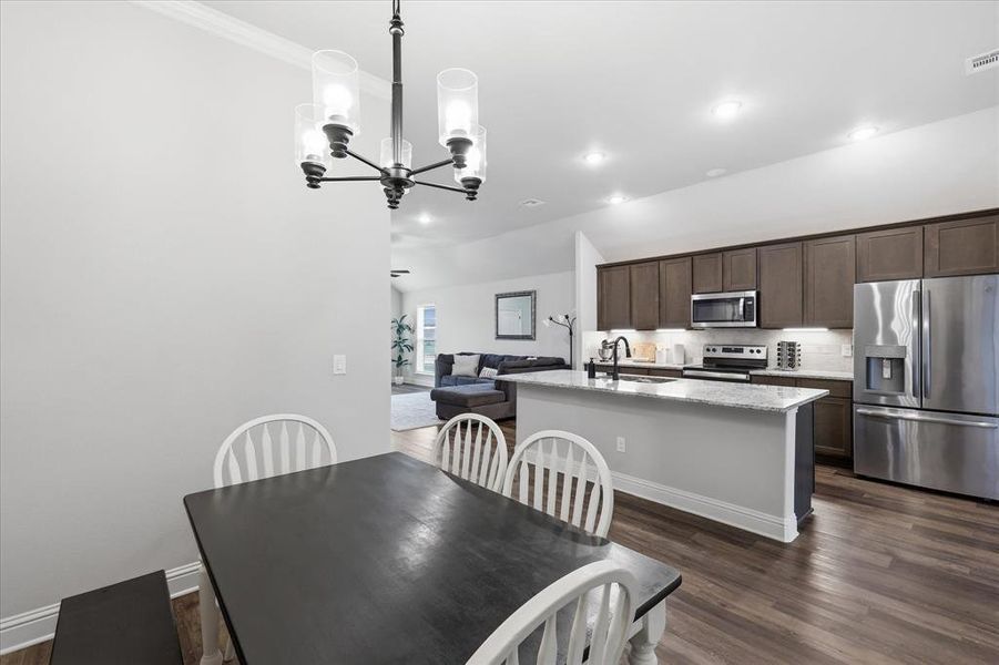 Kitchen features an open view into the dining area, creating a functional layout ideal for entertaining and everyday living.