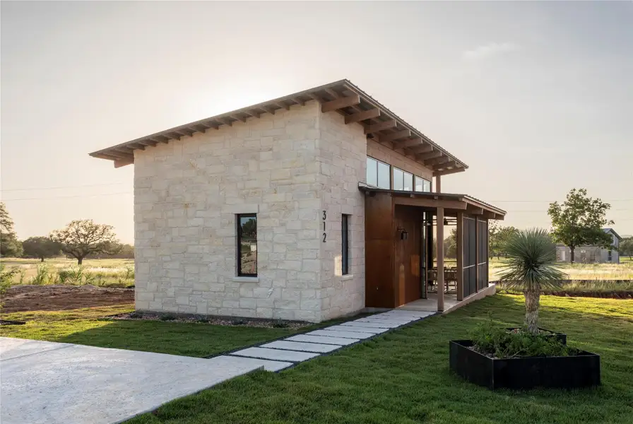 Front exterior of a new home in Hye Springs Ranch, Hye, TX, highlighting curb appeal (Image 17).