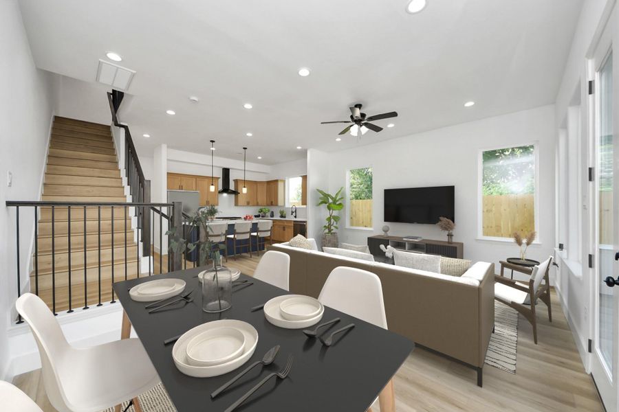 Open-concept layout with seamless flow from dining to living and kitchen areas. Bright, modern space designed for comfortable living and entertaining.