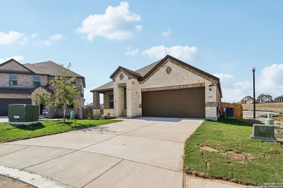 Front exterior of a new home in , San Antonio, TX, highlighting curb appeal (Image 1). Front exterior of a new home in , San Antonio, TX, highlighting curb appeal (Image 1).