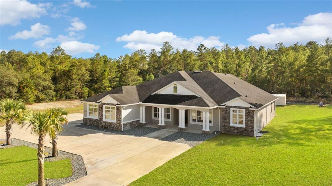 Front exterior of a new home in , Ocala, FL, highlighting curb appeal (Image 25).