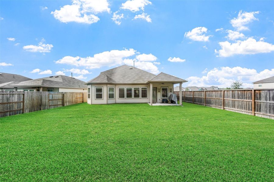Exterior details and patio area of a home in Pinewood at Grand Texas, New Caney (Image 4).