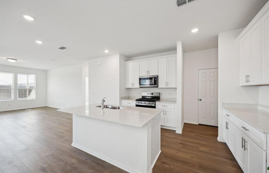 Spacious kitchen with eat-in bar top island Spacious kitchen with eat-in bar top island