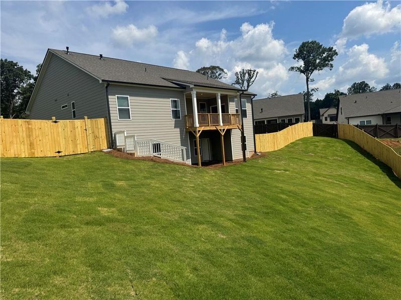 Exterior details and patio area of a home in Rosewood Lake Preserve, Hoschton (Image 21).