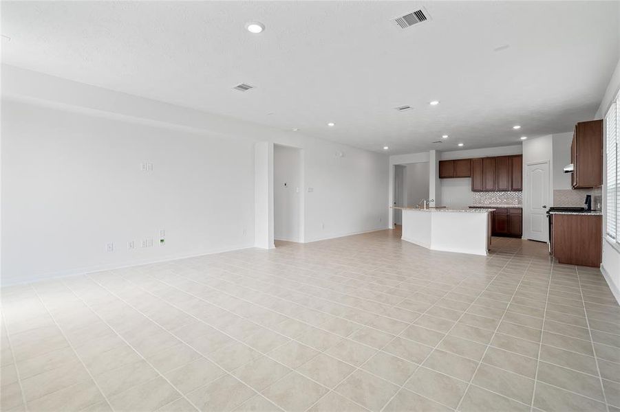 Another gorgeous view of the great room looking into the kitchen and dining area.