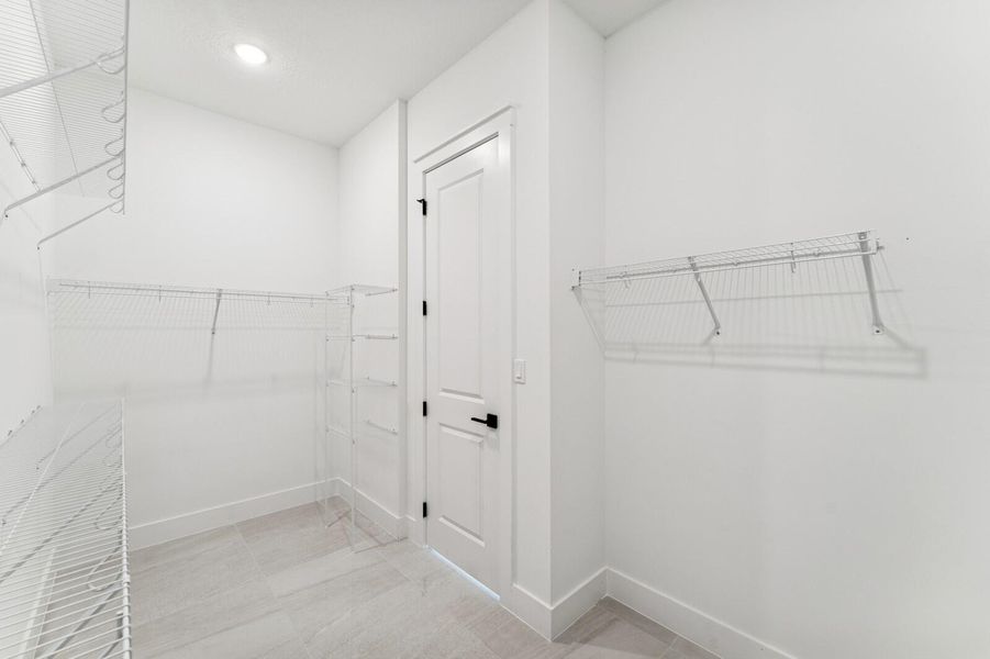 Primary Walk-in Closet Primary Walk-in Closet