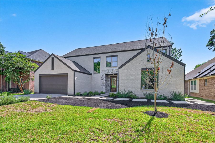 Front exterior of a new home in , Conroe, TX, highlighting curb appeal (Image 23).