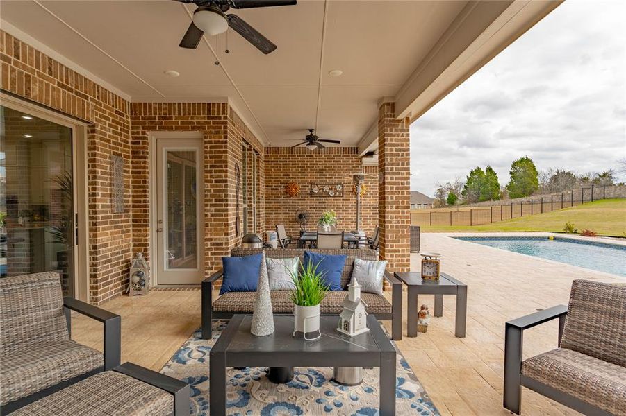 View of patio / terrace with ceiling fan and an outdoor living space