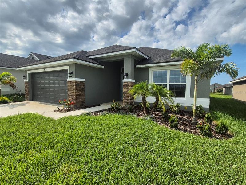 Front exterior of a new home in Abbey Glen, Dade City, FL, highlighting curb appeal (Image 15). Front exterior of a new home in Abbey Glen, Dade City, FL, highlighting curb appeal (Image 15).