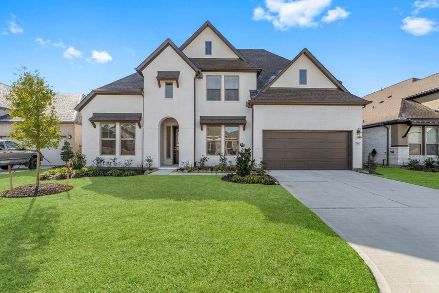 Front exterior of a new home in The Highlands, Porter, TX, highlighting curb appeal (Image 1). Front exterior of a new home in The Highlands, Porter, TX, highlighting curb appeal (Image 1).