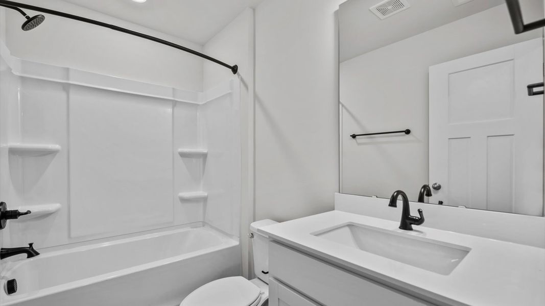 Representative furnished interior of a home built from the Jasmine by DRB Homes in Harrier Point, Woodruff (Image 15).