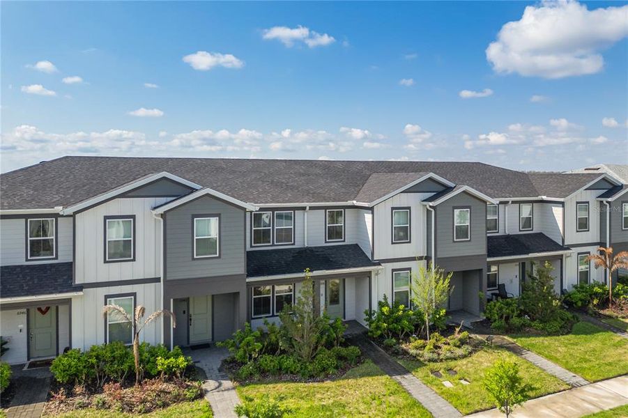 Front exterior of a new home in , Orlando, FL, highlighting curb appeal (Image 26).