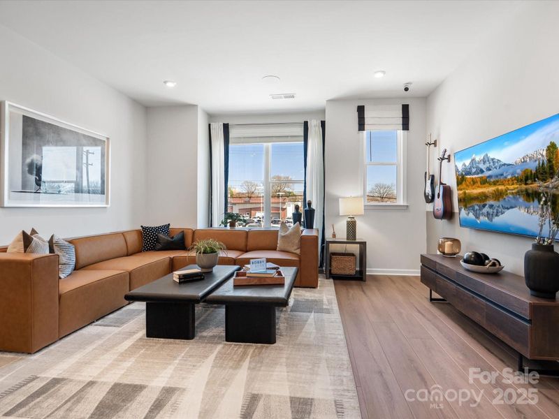 Great Room Filled with Light from Large Energy Efficient Windows.