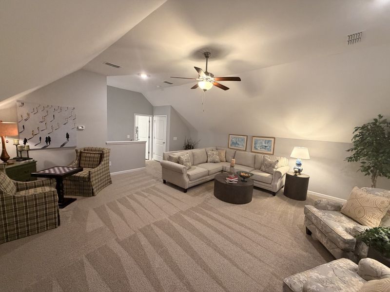 *Stock Photo* Another angle of the Upstairs Bonus Room that showcased the 1/2 wall to keep it bright and airy! Also the 3rd Full Bathroom and Walk-in Attic Storage! *Stock Photo* Another angle of the Upstairs Bonus Room that showcased the 1/2 wall to keep it bright and airy! Also the 3rd Full Bathroom and Walk-in Attic Storage!