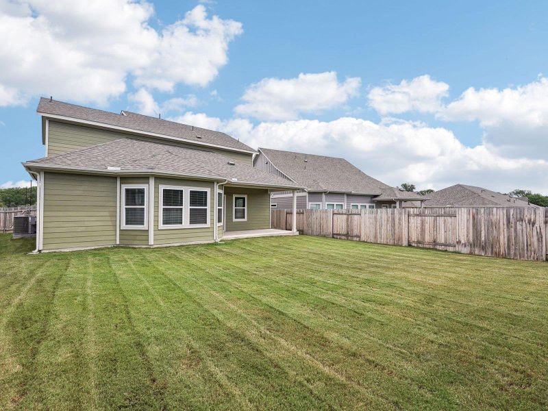 Exterior details and patio area of a home in Riverbend at Double Eagle - Boulevard Collection, Cedar Creek (Image 3). Exterior details and patio area of a home in Riverbend at Double Eagle - Boulevard Collection, Cedar Creek (Image 3).