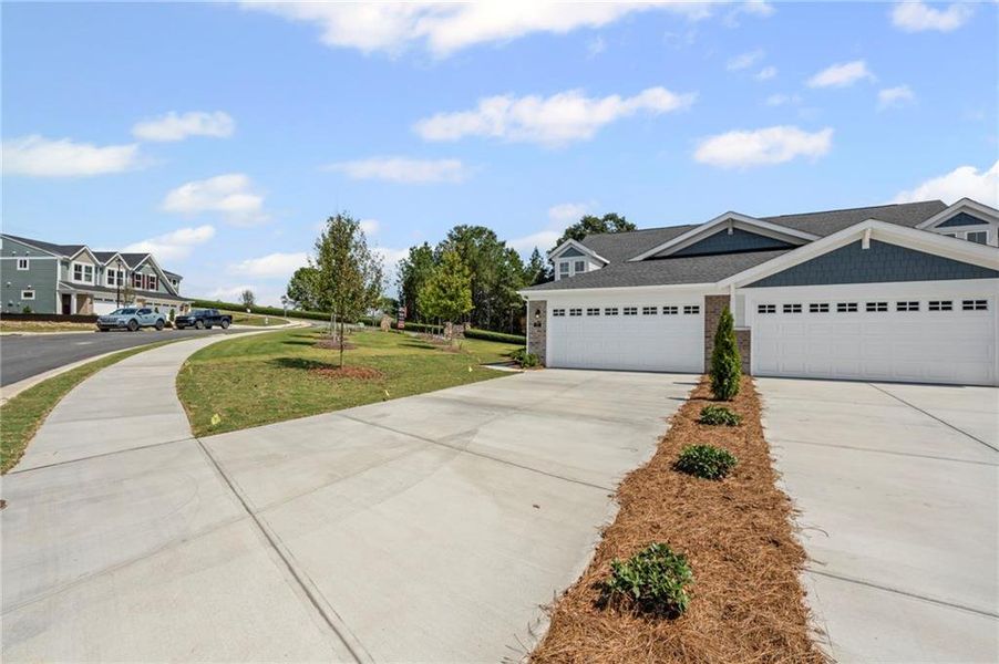 Front exterior of a new home in Villas at Gold Creek, Dawsonville, GA, highlighting curb appeal (Image 1).