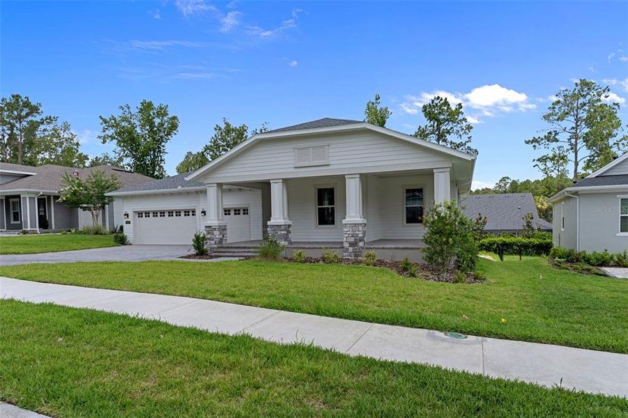 Front exterior of a new home in Southern Hills Plantation, Brooksville, FL, highlighting curb appeal (Image 23). Front exterior of a new home in Southern Hills Plantation, Brooksville, FL, highlighting curb appeal (Image 23).