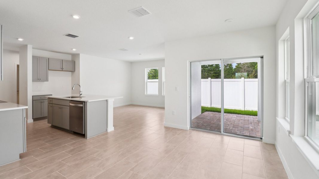 Kitchen and Entry in the Monterey End Townhome by DRB Homes - Cyrene at Harmony in St Cloud FL