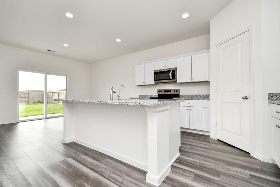 Furnished interior view inside a new home in Sunterra, Katy (Image 12).