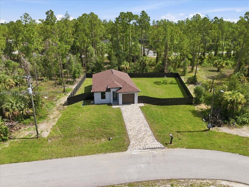 Front exterior of a new home in , Lehigh Acres, FL, highlighting curb appeal (Image 25).