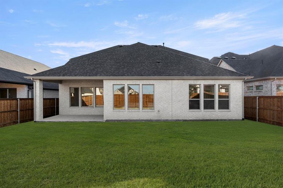 Exterior details and patio area of a home in Trinity Falls 60, McKinney (Image 4). Exterior details and patio area of a home in Trinity Falls 60, McKinney (Image 4).