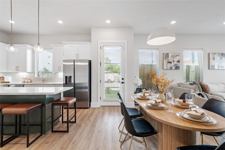 A sense of openness is immediately established upon entry, with 10-foot ceilings and a layout designed to promote natural flow throughout the main living level.