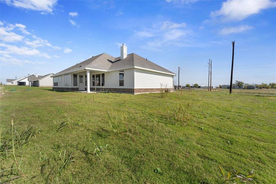 Exterior details and patio area of a home in Clear Sky Addition, Valley View (Image 29).