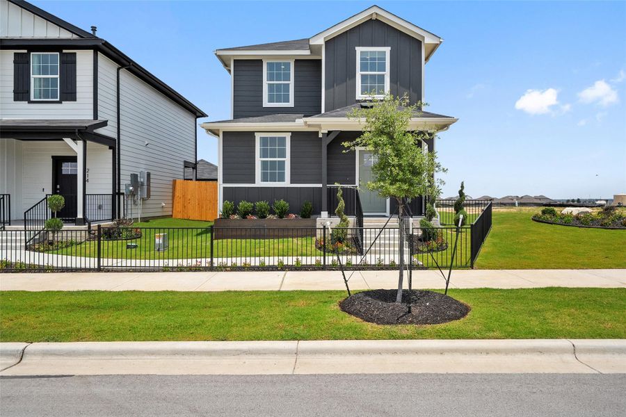 Front exterior of a new home in Valverde, Bastrop, TX, highlighting curb appeal (Image 1). Front exterior of a new home in Valverde, Bastrop, TX, highlighting curb appeal (Image 1).