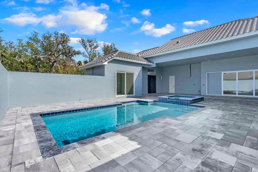 Front exterior of a new home in Toscana, Palm Coast, FL, highlighting curb appeal (Image 16).
