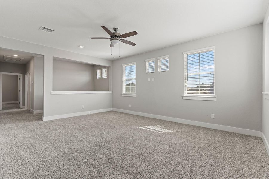 Unfurnished room featuring light colored carpet, a ceiling fan, and recessed lighting Unfurnished room featuring light colored carpet, a ceiling fan, and recessed lighting