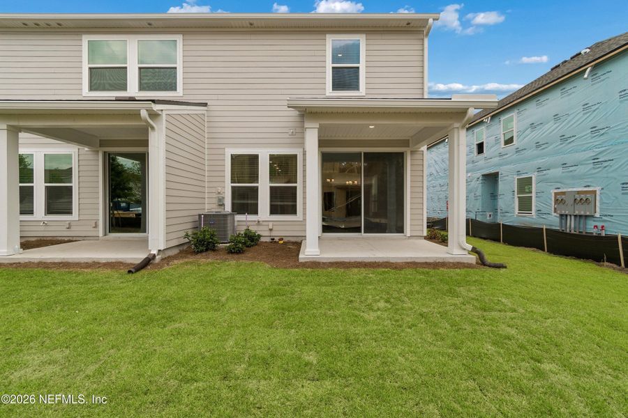 Exterior details and patio area of a home in Westerly Park at Wildlight – Overlook Collection, Yulee (Image 3). Exterior details and patio area of a home in Westerly Park at Wildlight – Overlook Collection, Yulee (Image 3).