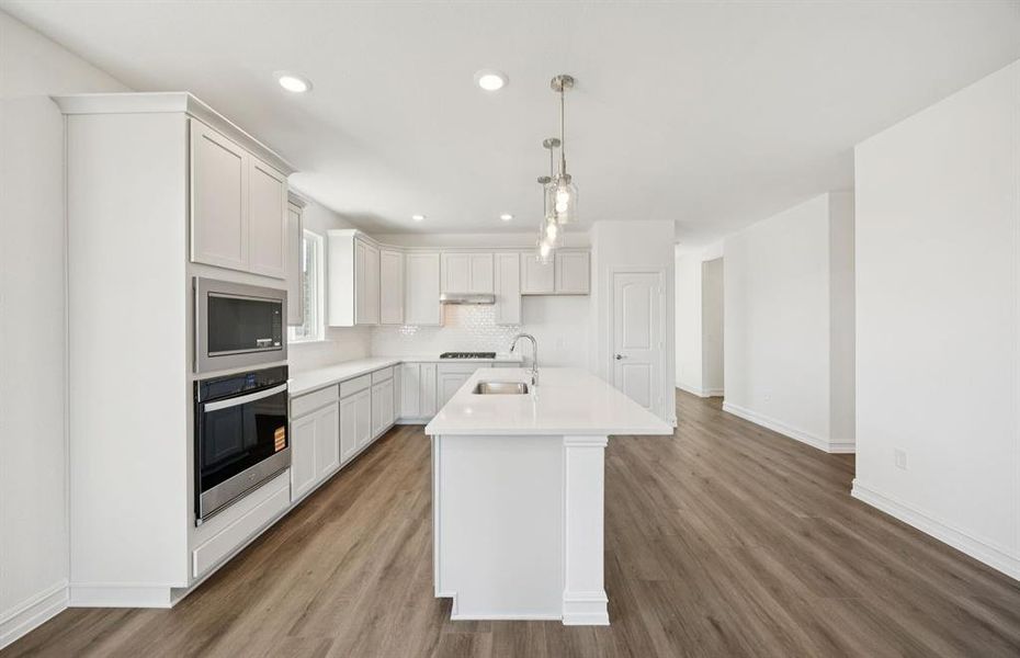 Spacious eat-in kitchen designed with a large island for dining