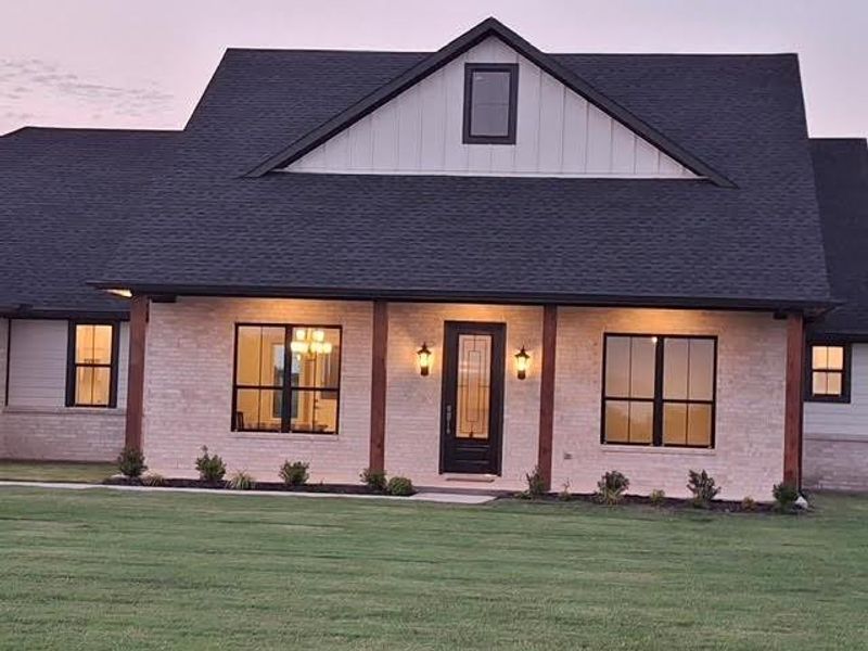 Front exterior of a new home in , Van Alstyne, TX, highlighting curb appeal (Image 2).
