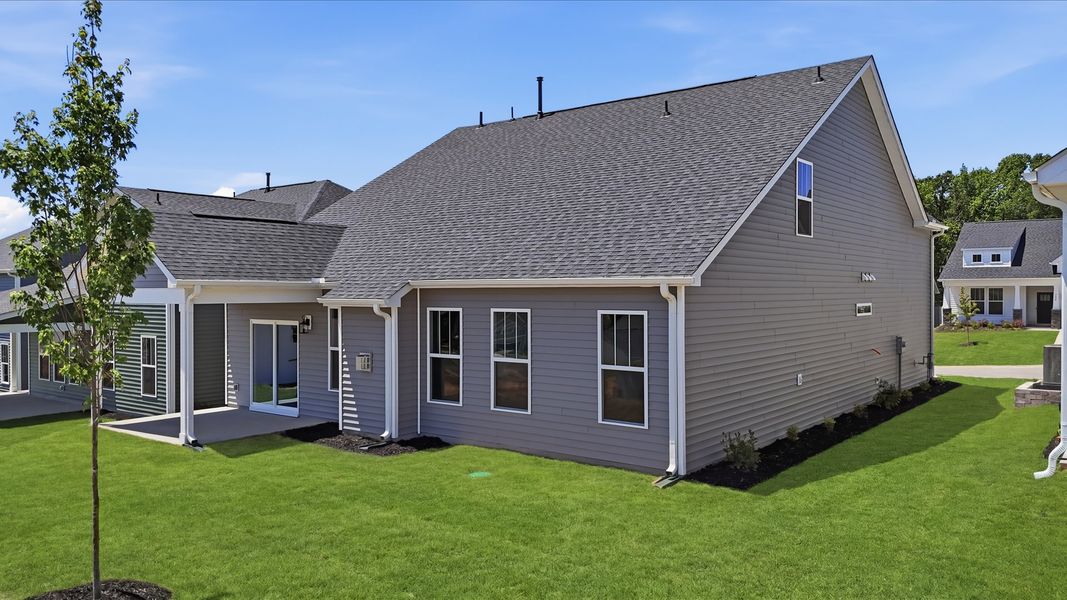 Highly functional rear covered porch adds memorable living space to this elegant home in Moore, SC