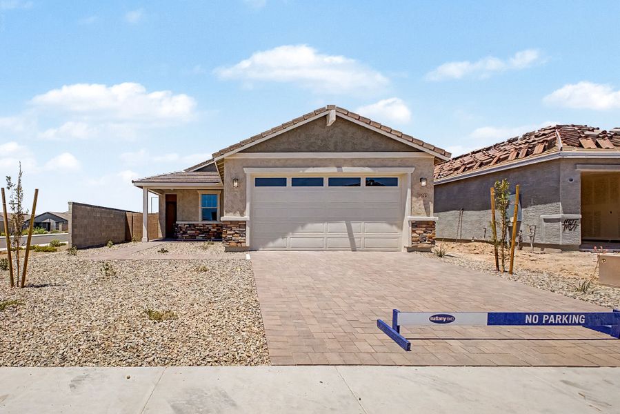 Front exterior of a new home in Tyler Ranch, Buckeye, AZ, highlighting curb appeal (Image 1). Front exterior of a new home in Tyler Ranch, Buckeye, AZ, highlighting curb appeal (Image 1).