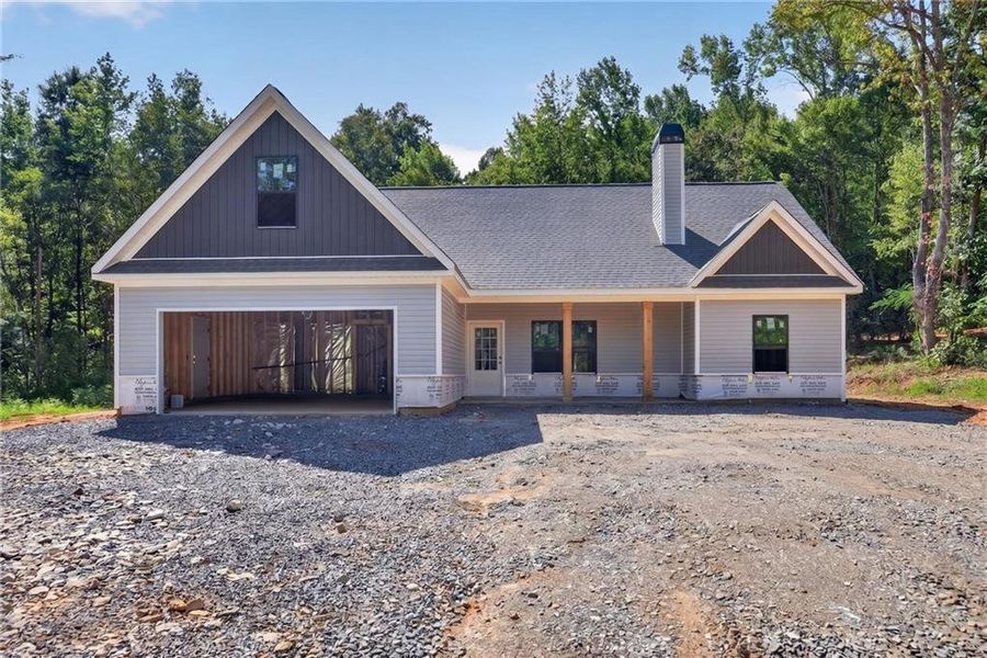 Front exterior of a new home in , Silver Creek, GA, highlighting curb appeal (Image 1). Front exterior of a new home in , Silver Creek, GA, highlighting curb appeal (Image 1).