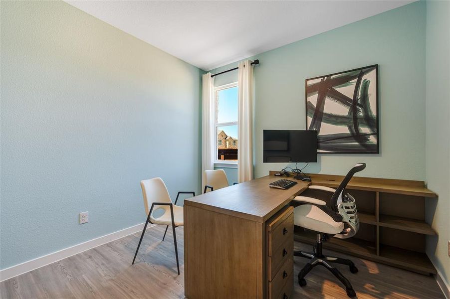 Office with hardwood / wood-style floors