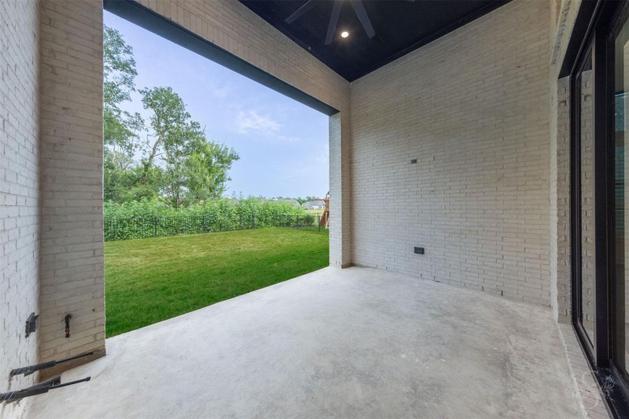 Covered back patio. Notice the added oversized fan for the space. Covered back patio. Notice the added oversized fan for the space.