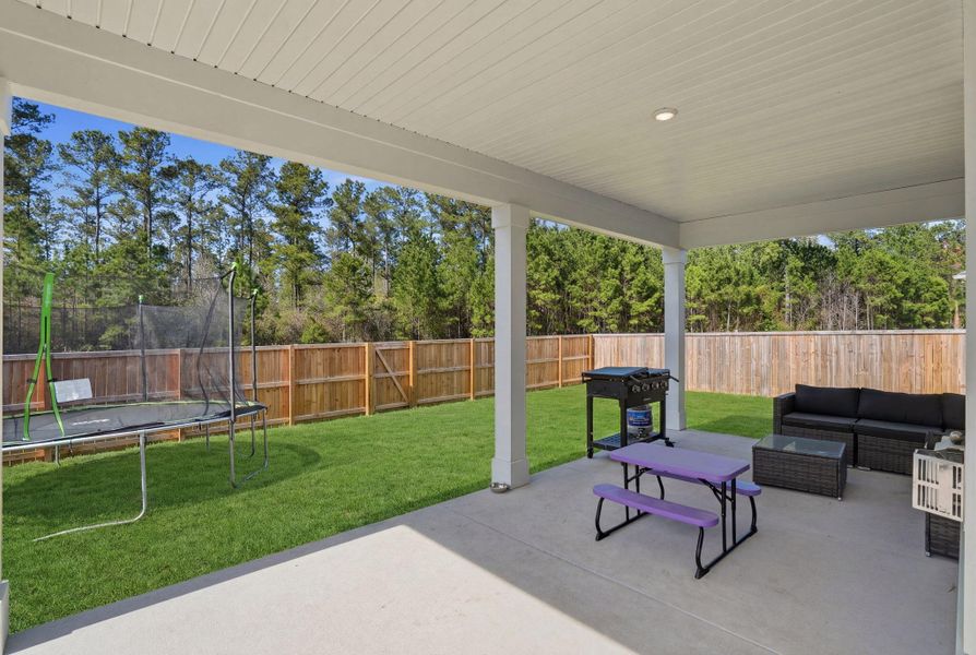 Exterior details and patio area of a home in Tidewater at Lakes of Cane Bay, Summerville (Image 4).